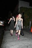 Avril Lavigne in pink boots and skimpy top